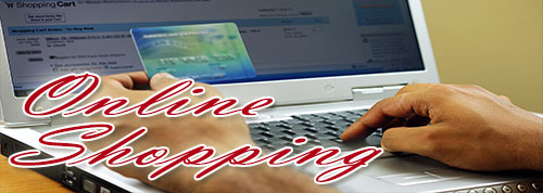 Online Shopping - person using a computer with credit card in hand